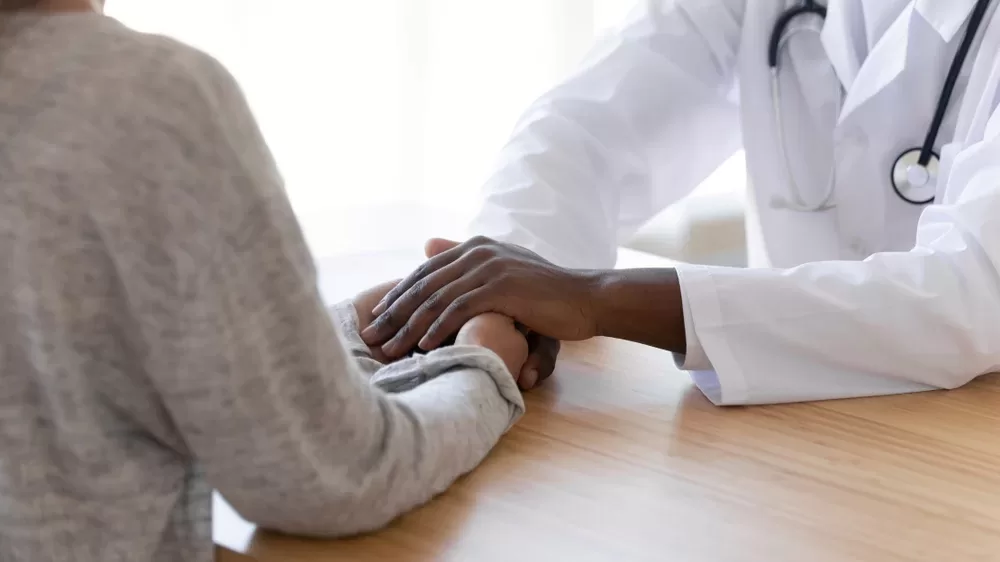 doctor consoling patient