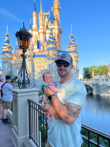 A dad and baby at Disney World