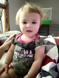A baby wearing camo