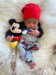 A baby with a red hat